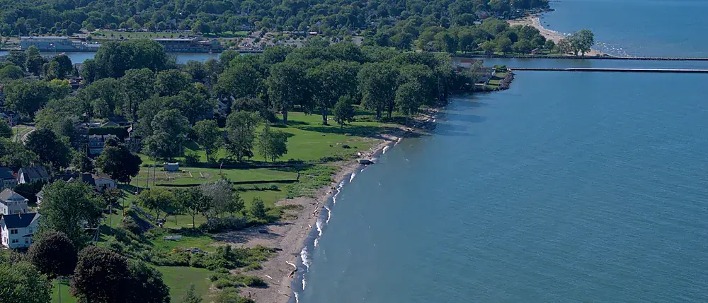 Drone photograph of a wooded point on Lake Ontario in Monroe County, New York