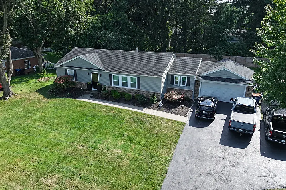 Aerial photo of a ranch home and driveway in Monroe County, New York