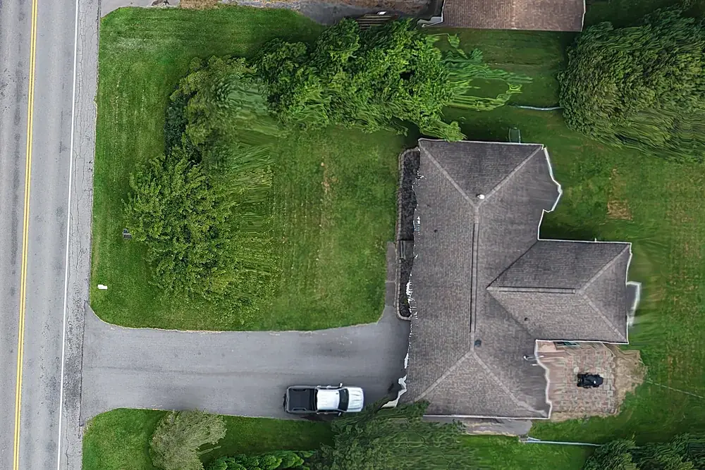 Orthomosaic detail showing a roof, driveway and vehicle straight down and to scale
