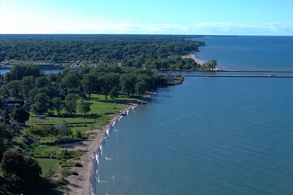 Aerial view of the Lake Ontario shoreline, beach and wooded waterfront near Rochester, New York